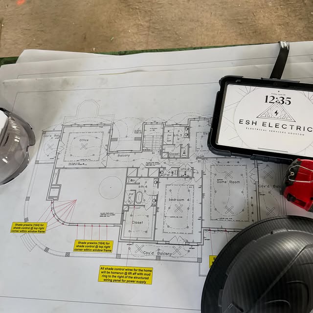 Electrical plans and E.S.H. Electric project materials for a residential project in League City, Texas.